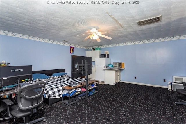 interior space with dark carpet and a textured ceiling