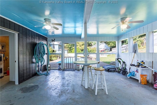 sunroom / solarium with ceiling fan