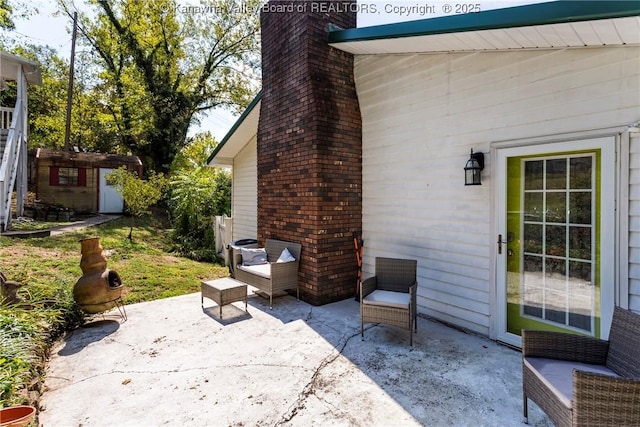 view of patio / terrace featuring a shed