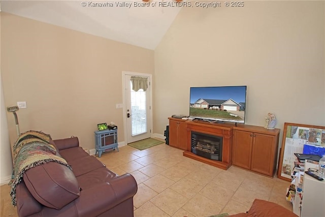 living room featuring high vaulted ceiling