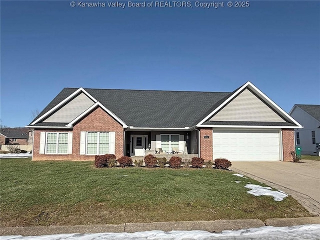 view of front of house featuring a garage and a front lawn