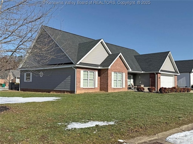 view of front of home featuring a garage and a front yard