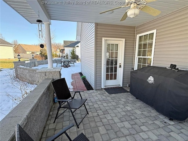 view of patio with ceiling fan and grilling area