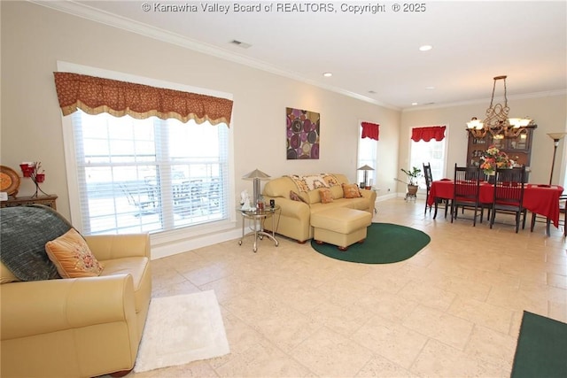 living room featuring crown molding and a notable chandelier