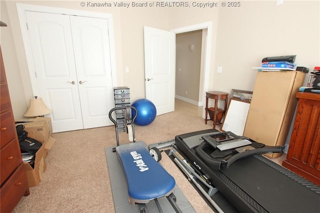 exercise room with light carpet