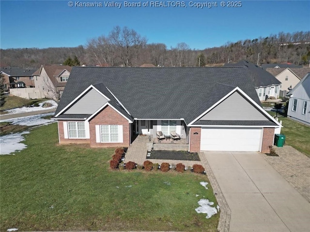 view of front of property with a garage and a front lawn