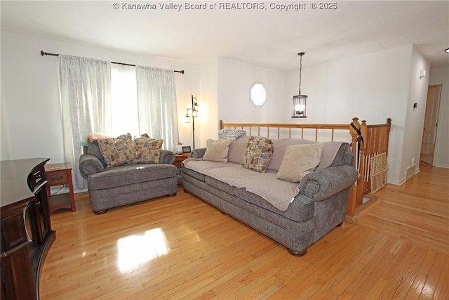 living room featuring plenty of natural light and light wood-type flooring