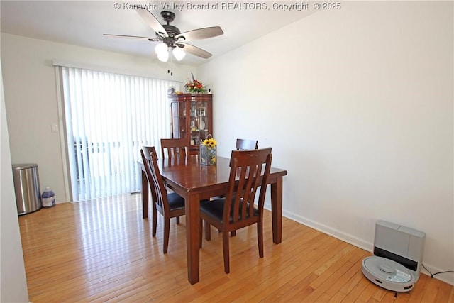 dining area with ceiling fan and light wood-type flooring