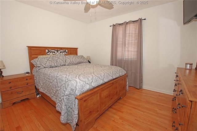 bedroom with ceiling fan and light hardwood / wood-style floors