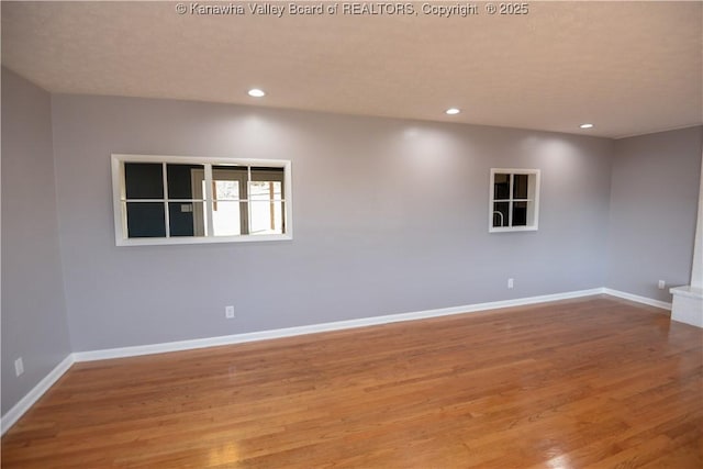 spare room featuring light hardwood / wood-style flooring