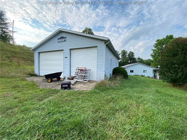 garage with a lawn