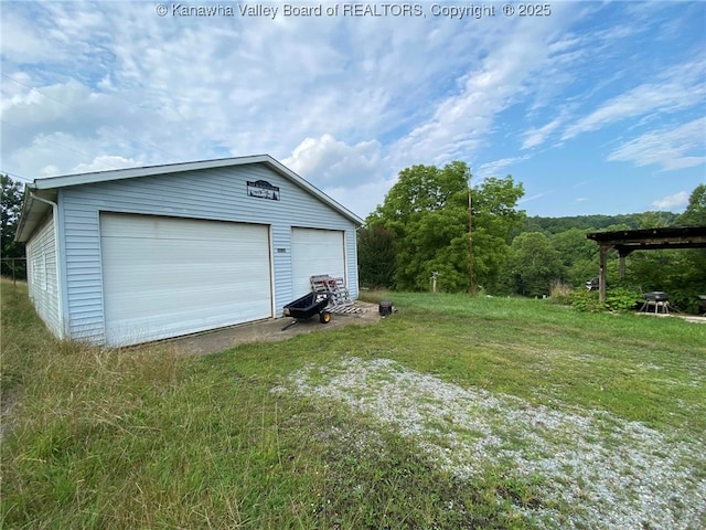 garage with a lawn