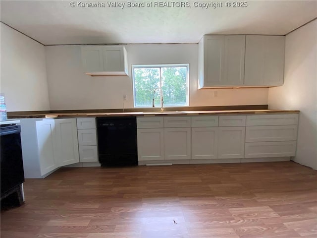 kitchen with white cabinetry, dishwasher, sink, and light hardwood / wood-style floors