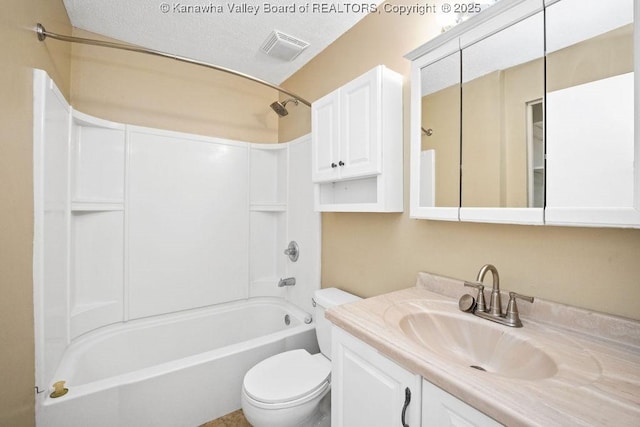 full bathroom with vanity, a textured ceiling, shower / tub combination, and toilet