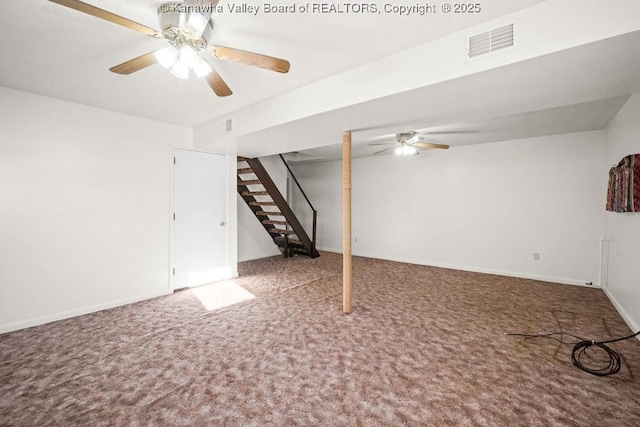 basement with carpet flooring and ceiling fan