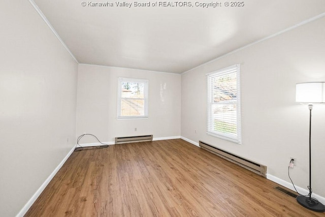 unfurnished room with a baseboard radiator, light wood-type flooring, and crown molding