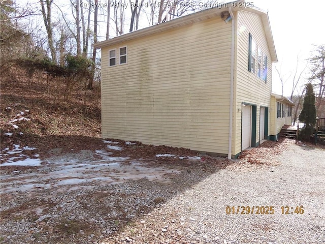 view of side of property with a garage