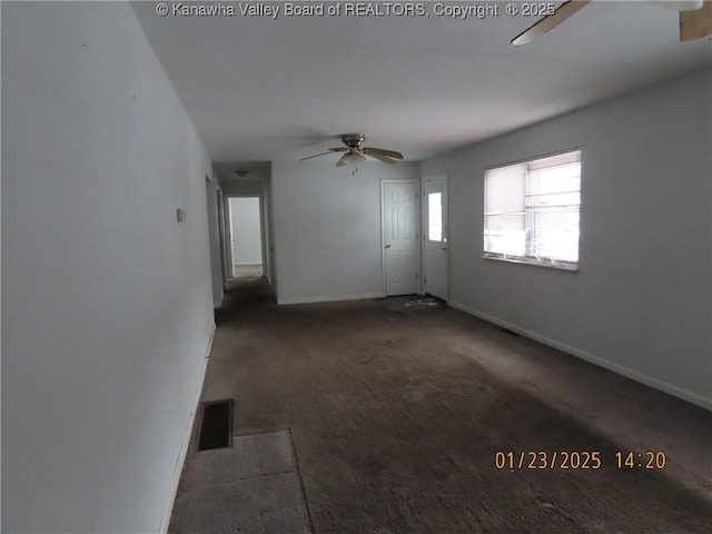 unfurnished living room featuring ceiling fan