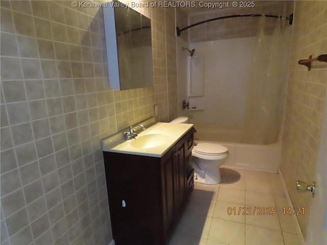 full bathroom featuring tile walls, vanity,  shower combination, toilet, and tile patterned floors