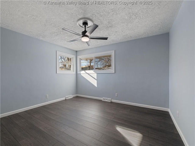 unfurnished room featuring dark hardwood / wood-style floors, a textured ceiling, and ceiling fan