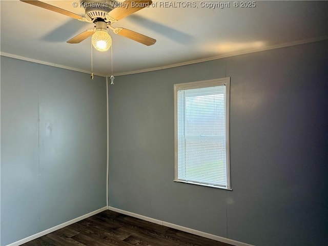 spare room with dark wood-type flooring, ceiling fan, plenty of natural light, and crown molding