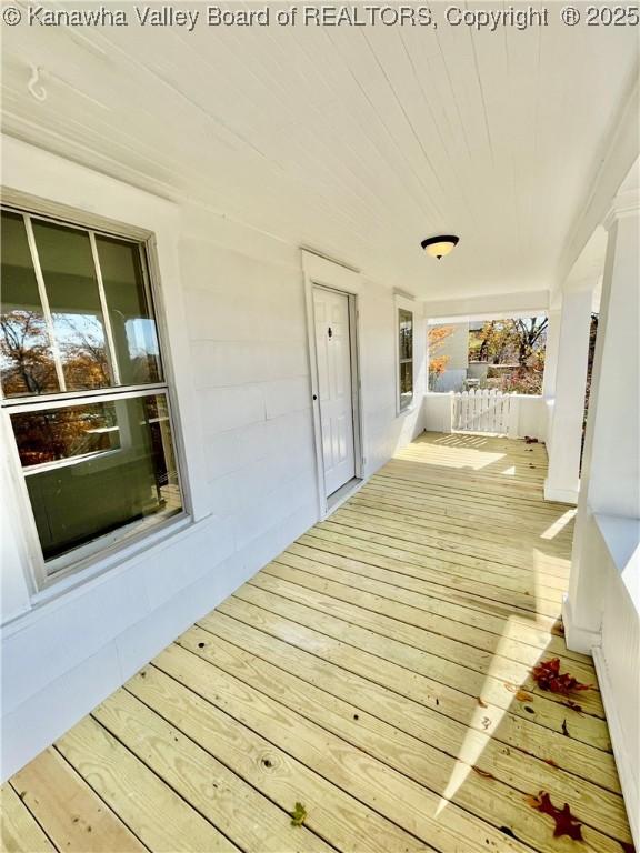 wooden terrace featuring a porch