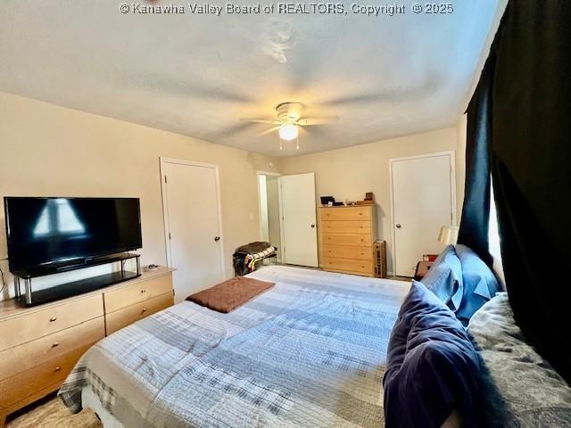 bedroom with ceiling fan and carpet floors