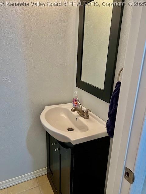 bathroom with vanity and tile patterned floors