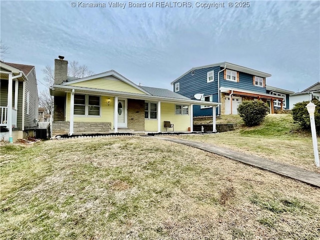 view of front of home with a front yard and a porch