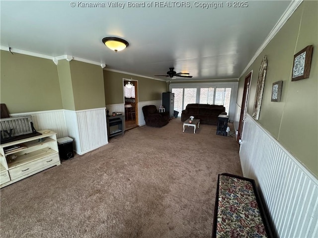 carpeted living room with ornamental molding