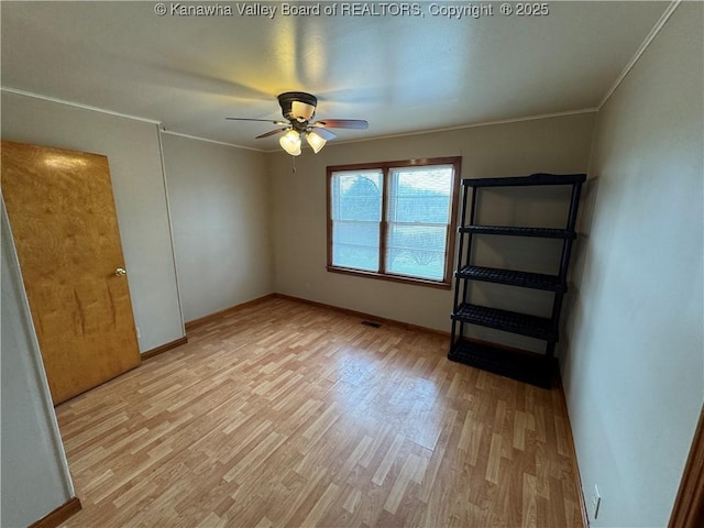 unfurnished bedroom with crown molding, light hardwood / wood-style flooring, and ceiling fan