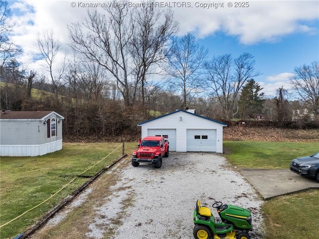 garage featuring a lawn