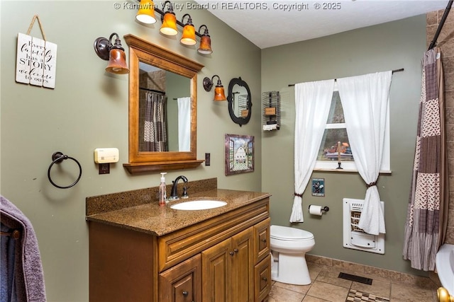 bathroom with vanity, toilet, curtained shower, and heating unit