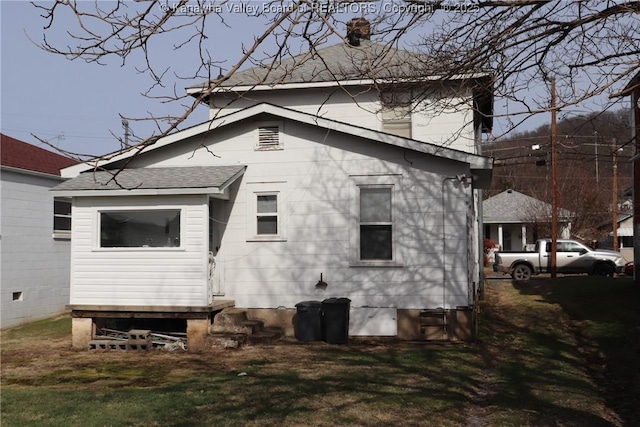 view of home's exterior featuring a yard