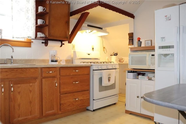 kitchen with tasteful backsplash, sink, white appliances, and extractor fan