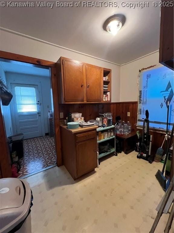 kitchen featuring wood walls