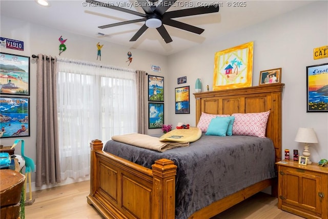 bedroom featuring ceiling fan and light wood-type flooring