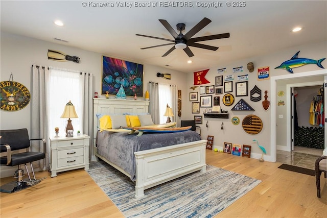 bedroom featuring ceiling fan and light wood-type flooring