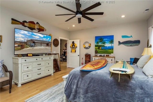 bedroom featuring light hardwood / wood-style flooring and ceiling fan