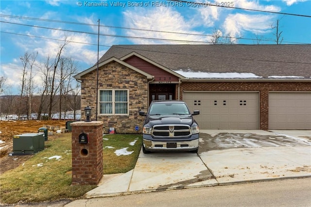 view of front of house featuring a garage and a front lawn