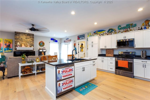 kitchen featuring sink, stainless steel appliances, and white cabinets