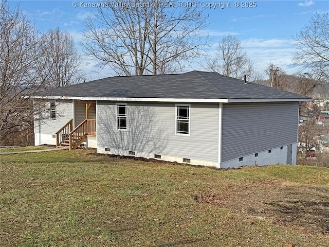 rear view of house with a yard