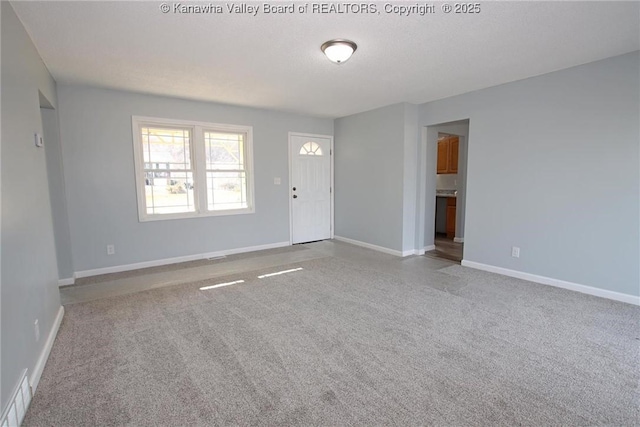 interior space featuring light colored carpet