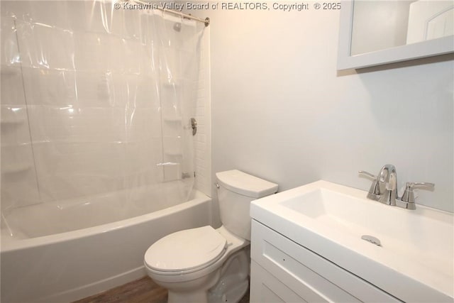 full bathroom with shower / tub combo with curtain, vanity, hardwood / wood-style floors, and toilet