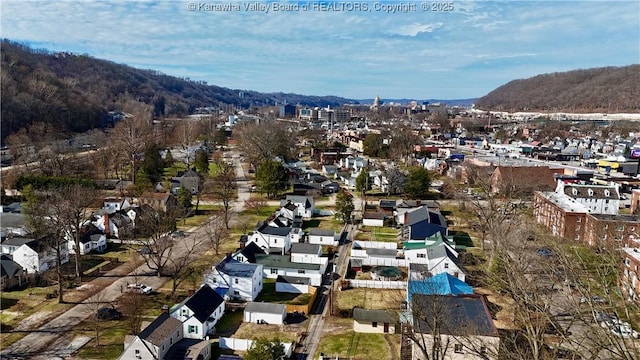 drone / aerial view featuring a mountain view