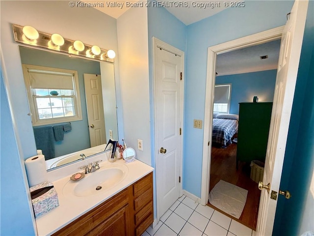 bathroom with vanity and tile patterned flooring