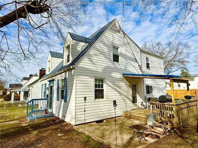 back of house with a patio area