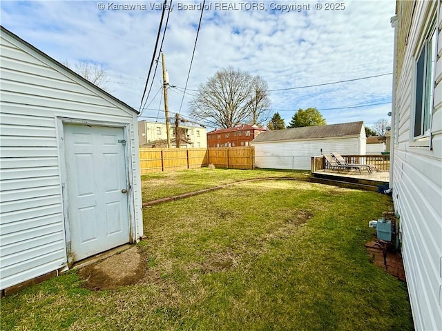 view of yard featuring an outbuilding and a deck