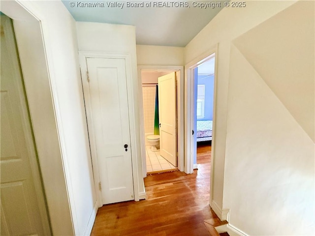 hallway featuring hardwood / wood-style flooring