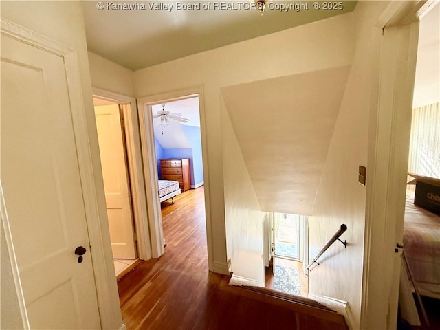 hallway with dark hardwood / wood-style floors